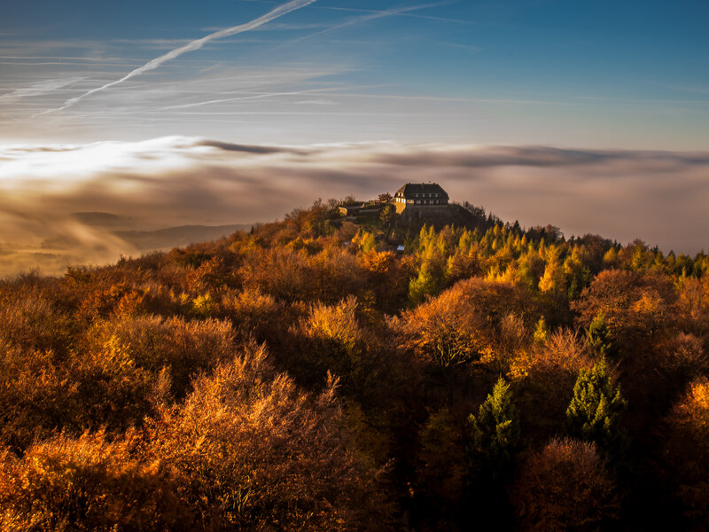 Hilltop with building and clouds